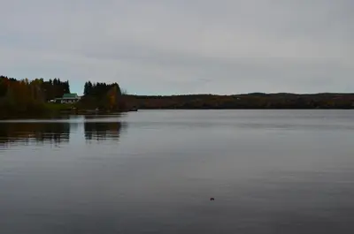 a large lake with a house in the middle of it at Chalet Esmeralda in Piopolis