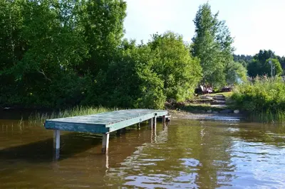 a bench sitting in the middle of a river at Chalet Esmeralda in Piopolis
