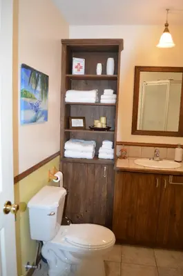 a bathroom with a toilet and a sink at Chalet Esmeralda in Piopolis