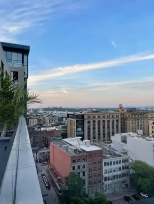 a view of a city from a building at Panoramic Apartment in the old port in Montréal