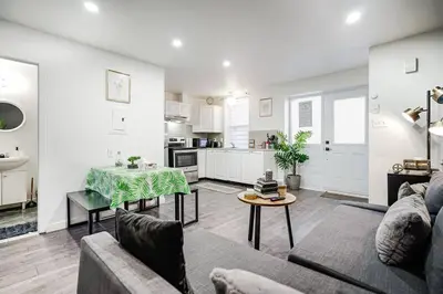 a living room with a couch and a table at Bienvenue dans votre havre de paix à Griffintown in Montréal