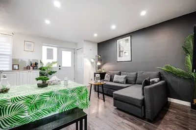 a living room with a couch and a table at Bienvenue dans votre havre de paix à Griffintown in Montréal
