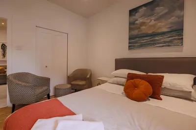a bedroom with a bed with a pumpkin on it at Saint Laurent Signature Hotel Montreal in Montréal
