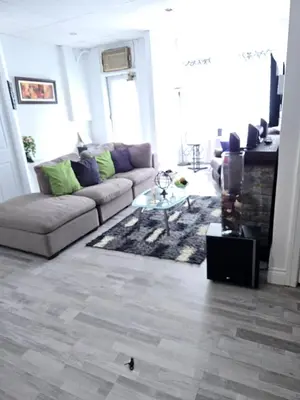 a living room with a couch and a table at SylverPrud in Beauceville