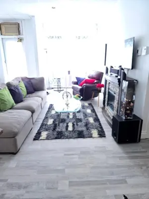 a living room with a couch and a coffee table at SylverPrud in Beauceville