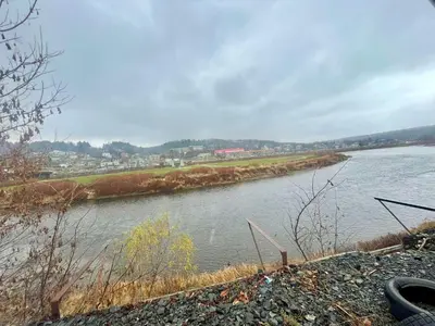 a view of a river with a city in the background at SylverPrud in Beauceville