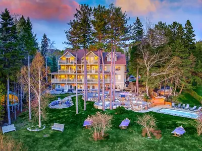 an aerial view of a large house with a pool at Estello Suites & Spa in Lac-Mégantic
