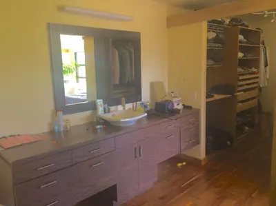 a bathroom with a sink and a large mirror at Spacious luxurious Villa, bright cottage, pool, Jacuzzi, sauna, nature in Mansonville