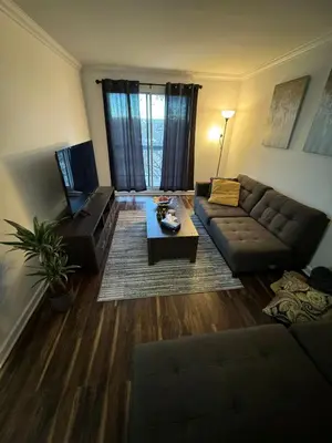 a living room with a couch and a coffee table at Ste-Rose 2 bedroom apt in Laval