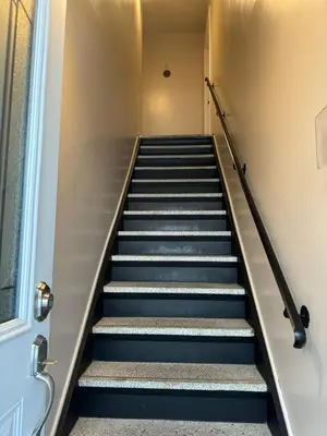 a staircase in a building with blue steps at Ste-Rose 2 bedroom apt in Laval