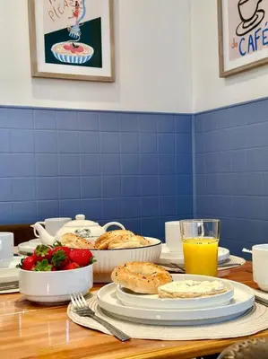 a table with food and orange juice on it at 3-Bedroom Apt - Low monthly rate - Le Plateau in Montréal