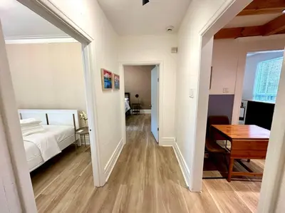 a bedroom with a bed and a desk and a table at 3-Bedroom Apt - Low monthly rate - Le Plateau in Montréal