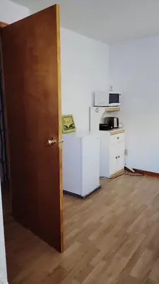 an open door in a room with a kitchen at CosyRoom in Brossard
