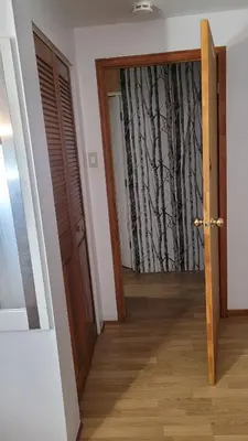a hallway with a door leading into a room at CosyRoom in Brossard