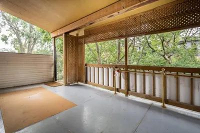 an empty balcony with a view of trees at Two bedroom duplex in Plateau Mont-Royal district in Montréal