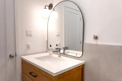 a bathroom with a sink and a mirror at #1 - Luxurious 2Bds - Self Check in - Plateau - St-Denis - AC - TV in Montréal