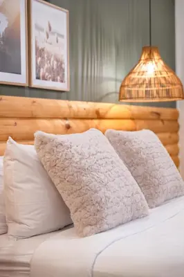 a bed with two pillows and a lamp on it at #2 - Cozy Studio - Self Check in - Plateau - St-Denis - AC - TV in Montréal