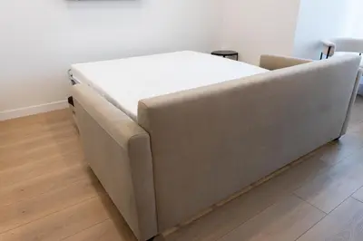 a large bed sitting on a wooden floor in a room at #5 - Spacious 3Bds - Self Check in - Plateau - St-Denis - AC - TV in Montréal