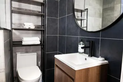 a bathroom with a toilet and a sink and a mirror at #6 - Artistic Studio - Self Check in - Plateau - St-Denis - AC - TV in Montréal