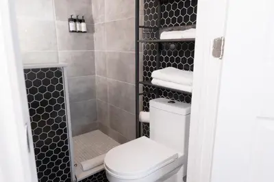 a bathroom with a toilet and a shower at #7 - Charming Studio - Self Check in - Plateau - St-Denis - AC - TV in Montréal