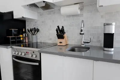 a kitchen with a sink and a counter top at #10 - Serene Studio - Self Check in - Plateau - St-Denis - AC - TV in Montréal