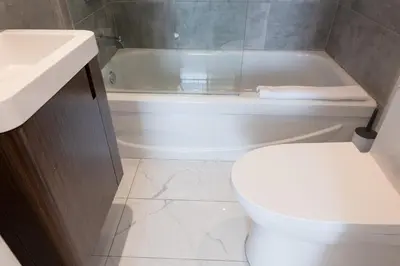 a bathroom with a toilet and a tub and a sink at #10 - Serene Studio - Self Check in - Plateau - St-Denis - AC - TV in Montréal