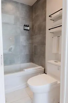 a bathroom with a toilet and a glass shower at #10 - Serene Studio - Self Check in - Plateau - St-Denis - AC - TV in Montréal