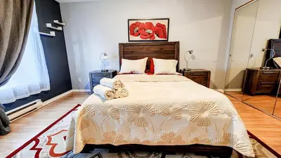 a bedroom with a bed with two teddy bears on it at Condo de charme familial in Brossard
