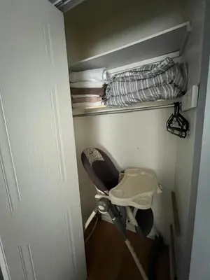 a bathroom with a toilet in a room at Condo de charme familial in Brossard