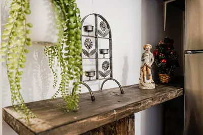 a wooden table with a figurine on top of it at Charmant appartement de 2 chambres à Griffintown in Montréal