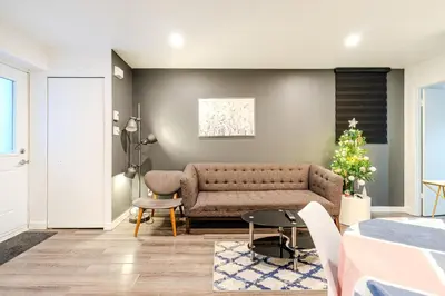 a living room with a couch and a table at Cozy 2-Bedroom in Griffintown in Montréal
