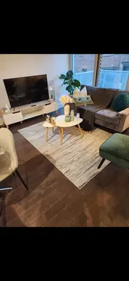 a living room with a couch and a coffee table at Condo 2 chambres avec parking privé - Griffintown in Montréal