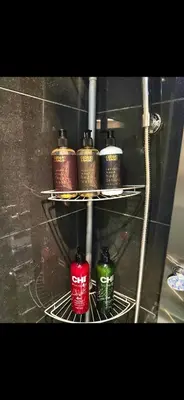 a shelf with four bottles on it at Condo 2 chambres avec parking privé - Griffintown in Montréal