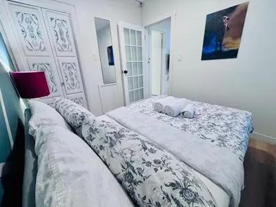 a bedroom with a bed with two pillows on it at Small but Equipped Unit in Montréal