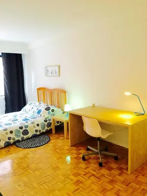 a bedroom with a desk and a bed and a desk at Stylish Montreal Apartment Comfortable Stay in the Golden Square Mile in Montréal