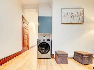 a laundry room with a washer and dryer at Great 3B unit on Saint-Urbain in Montréal