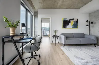 a living room with a couch and a table at Appartements Dorchester in Montréal