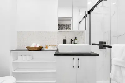 a white bathroom with a sink and a shower at Boutique 4BR Luxury Residence 2 Floors Mile-End St-Laurent in Montréal