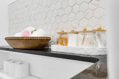 a shelf in a kitchen with a bowl of towels at Boutique 4BR Luxury Residence 2 Floors Mile-End St-Laurent in Montréal