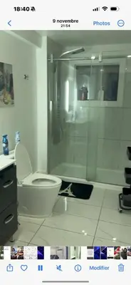 a bathroom with a toilet and a glass shower at Marlene in Montréal