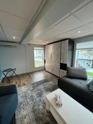 a living room with a couch and a table at Main Street in North Hatley