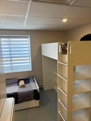 a room with a bed and a bunk bed at La maison internationale de Montréal in Montréal