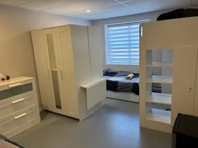 a small bedroom with a bed and a window at La maison internationale de Montréal in Montréal