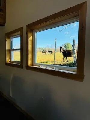 a window in a room with a view of a field at Le Garage 17 in Frelighsburg