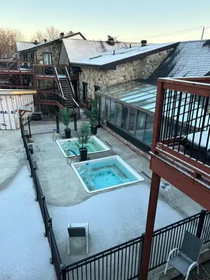 a balcony of a house with a swimming pool at Condos hotel lion d or in Magog-Orford