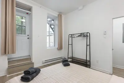 a room with a room with a mirror on the floor at Three bedroom chic condo downtown Montreal in Montréal