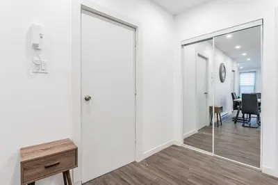 an office with a sliding glass door and a desk at Huge 3 Bedroom Condo with a Large Patio in Montréal