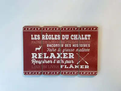 a brown wallet with white writing on it at Chalet Le PÜR in Eastman