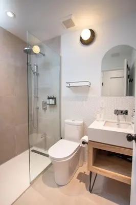a bathroom with a toilet and a shower and a sink at Studio #1 - Self Check-In - Plateau - St-Denis in Montréal