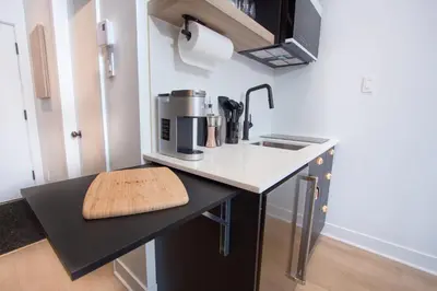 a kitchen with a counter with a coffee maker on it at Studio #2 - Self Check-In - Plateau - St-Denis in Montréal